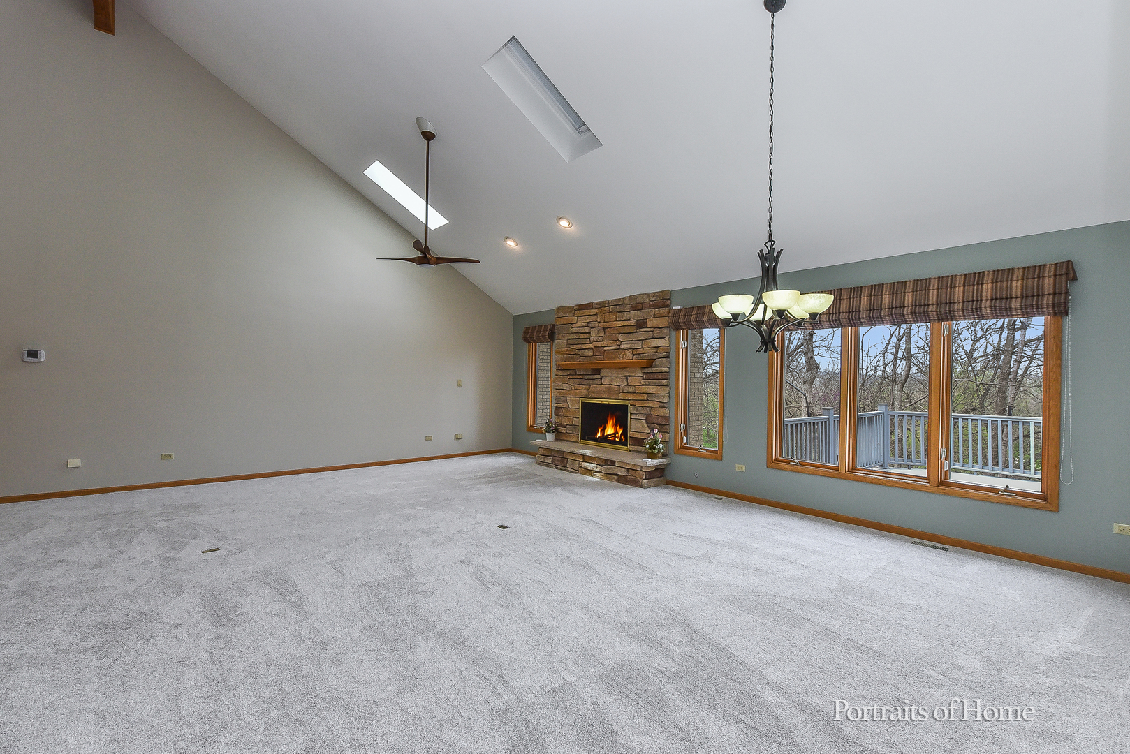11 Merrimack Court Bolingbrook, IL 60440 - Photo 8 of 46 a view of an empty room with a fireplace and a window