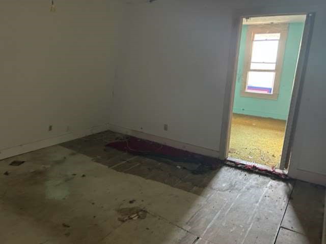 1314 Sixth Street Angleton, TX 77515 - Photo 4 of 8 an empty room with a window