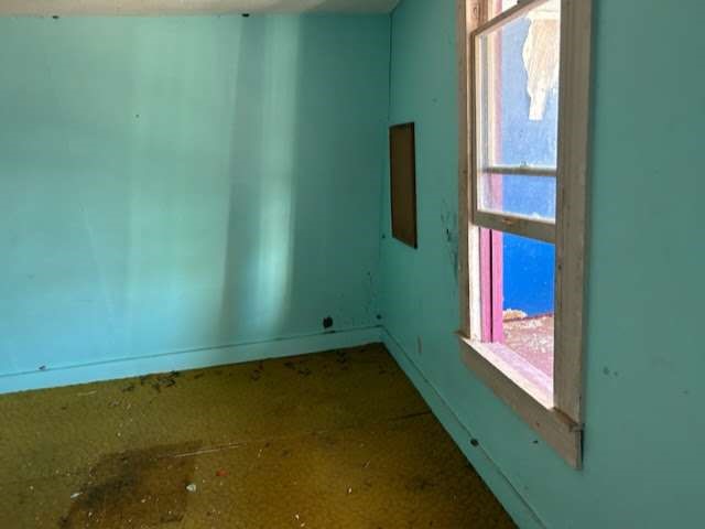 1314 Sixth Street Angleton, TX 77515 - Photo 5 of 8 a view of an empty room and window