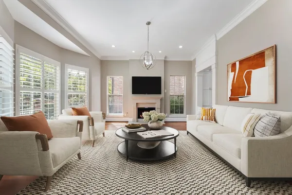 a bedroom with a large bed rug and window