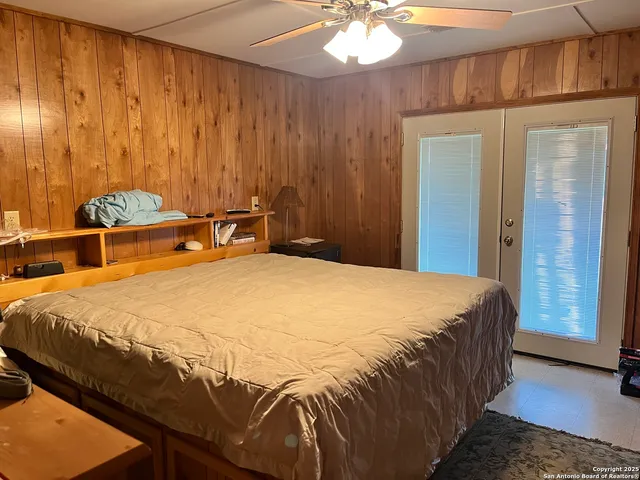 a view of house with a big yard and sitting area