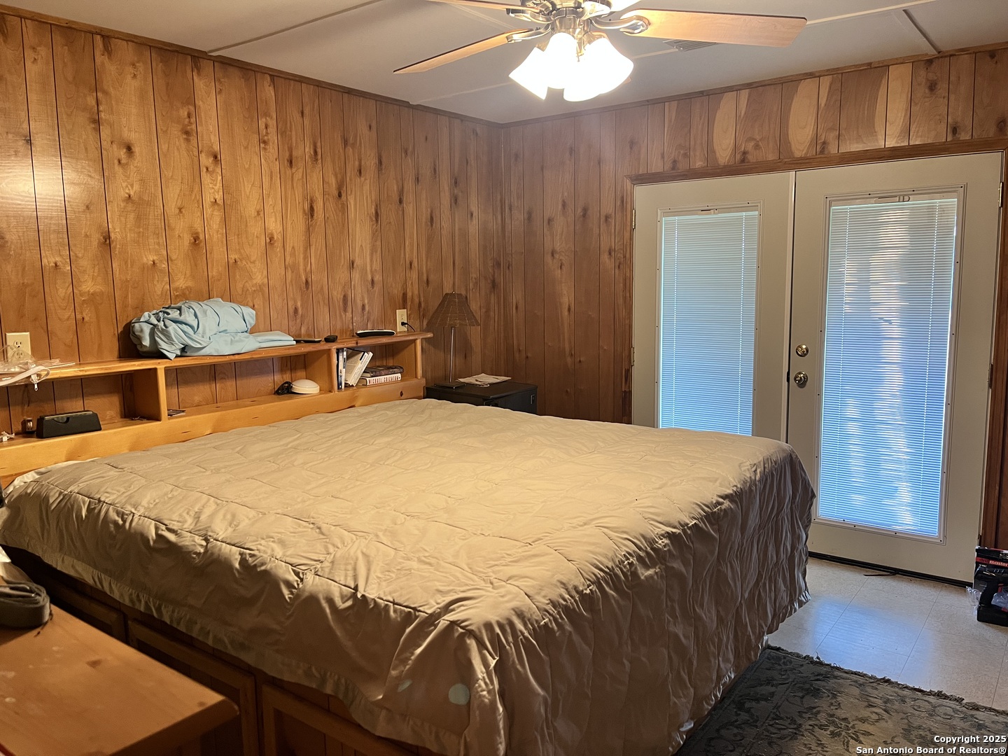 104 SD 14070 Rocksprings, TX 78880 - Photo 14 of 71 a bedroom with a bed and a chandelier