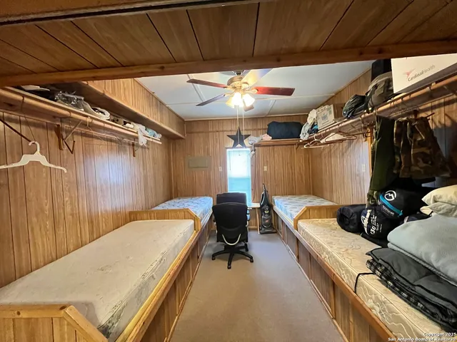 a house with green field in front of it