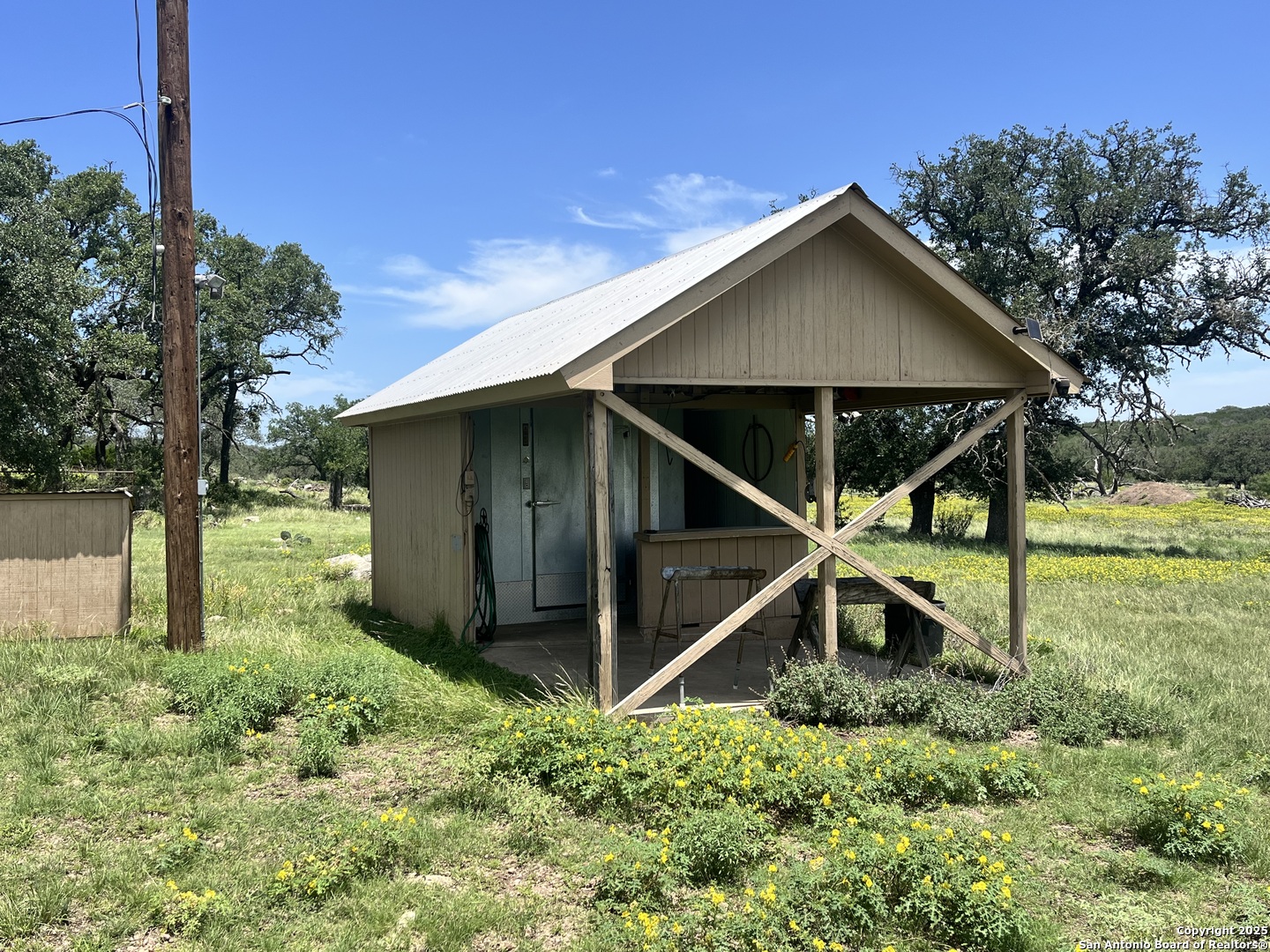 104 SD 14070 Rocksprings, TX 78880 - Photo 19 of 71 a house with green field in front of it