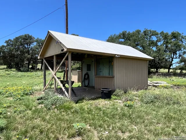 an aerial view of residential houses with city view