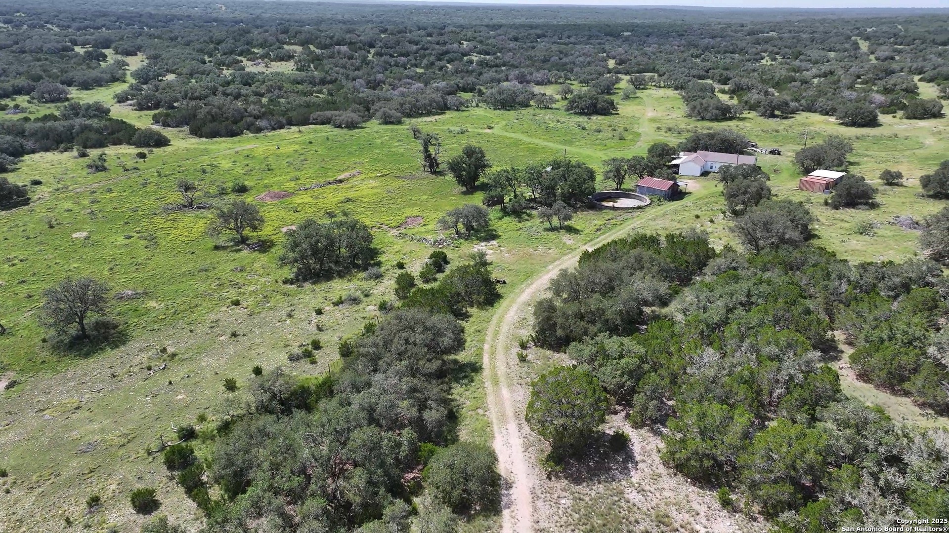 104 SD 14070 Rocksprings, TX 78880 - Photo 4 of 71 an aerial view of residential houses with outdoor space and trees