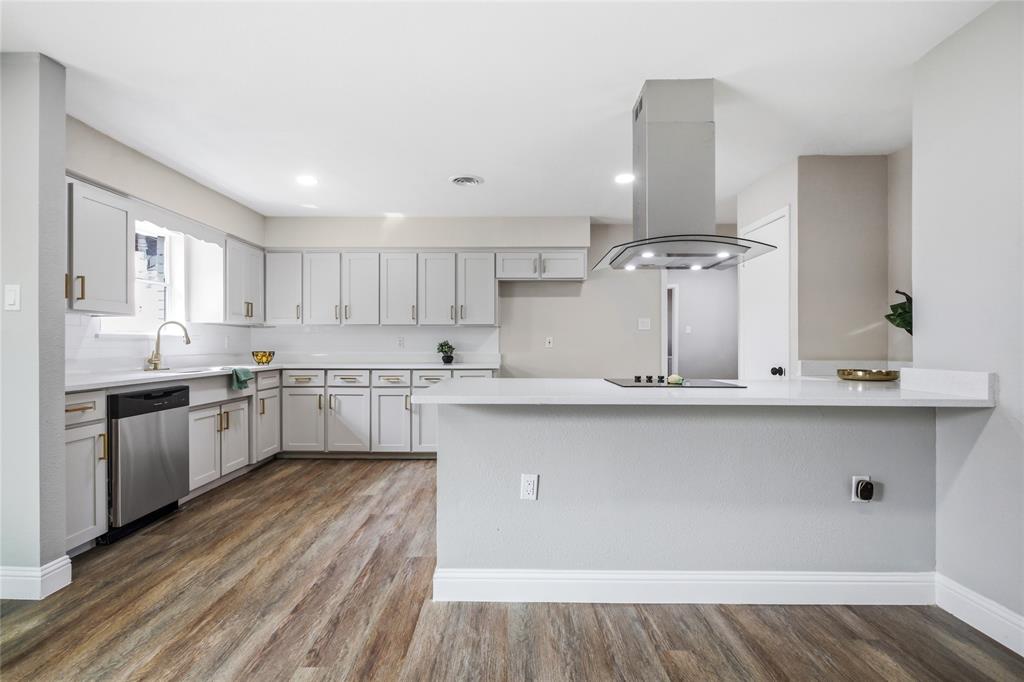1708 Park Ridge Terrace Arlington, TX 76012 - Photo 13 of 37 Wood-finish flooring with white baseboards and light gray walls