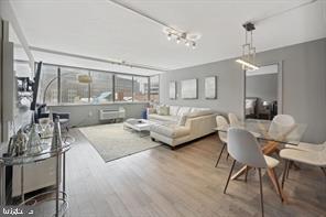 1325 18th Street Northwest, Unit 703 Washington, DC 20036 - Photo 2 of 10 a bedroom with furniture and a large window