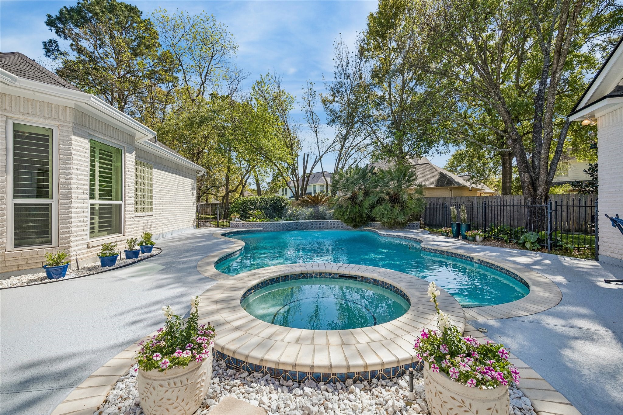 16407 Emilia Court Spring, TX 77379 - Photo 31 of 35 Resort style pool area with lush landscaping for your visual senses as you float poolside!