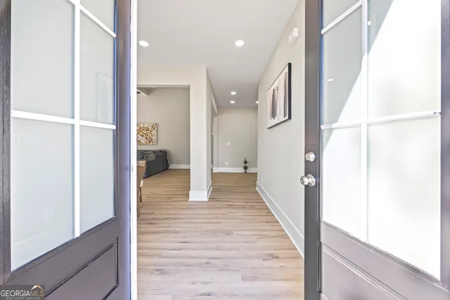 a kitchen with granite countertop stainless steel appliances a sink stove top oven and refrigerator