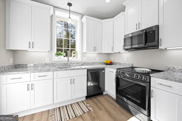 a living room with furniture window and wooden floor