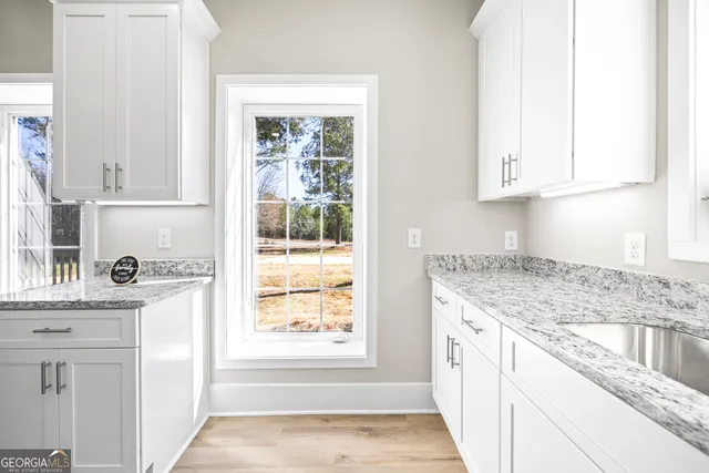 a bathroom with a double vanity sink mirror and