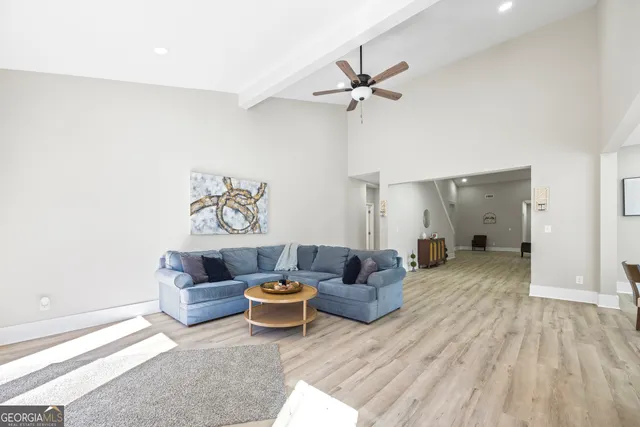 a view of a livingroom with a furniture wooden floor and a window