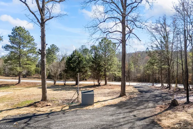 a view of balcony with wooden floor and fence