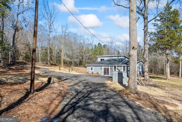 a view of a yard with trees