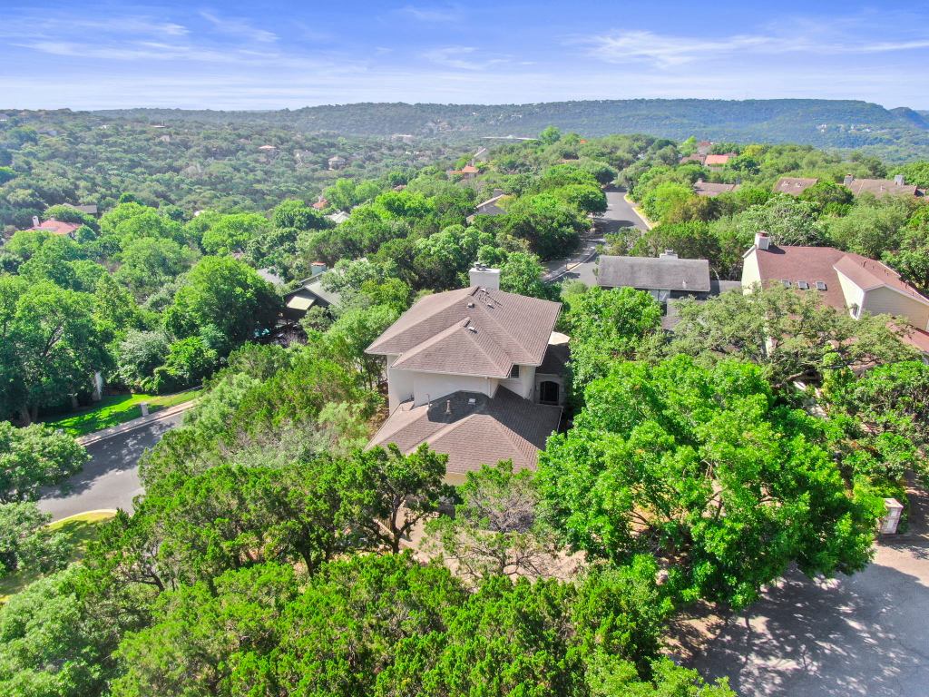 an aerial view of a city with lots of residential buildings in the back