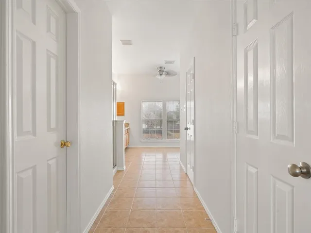 a view of room with window and wooden floor