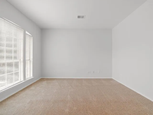 a bathroom with a sink vanity mirror and toilet