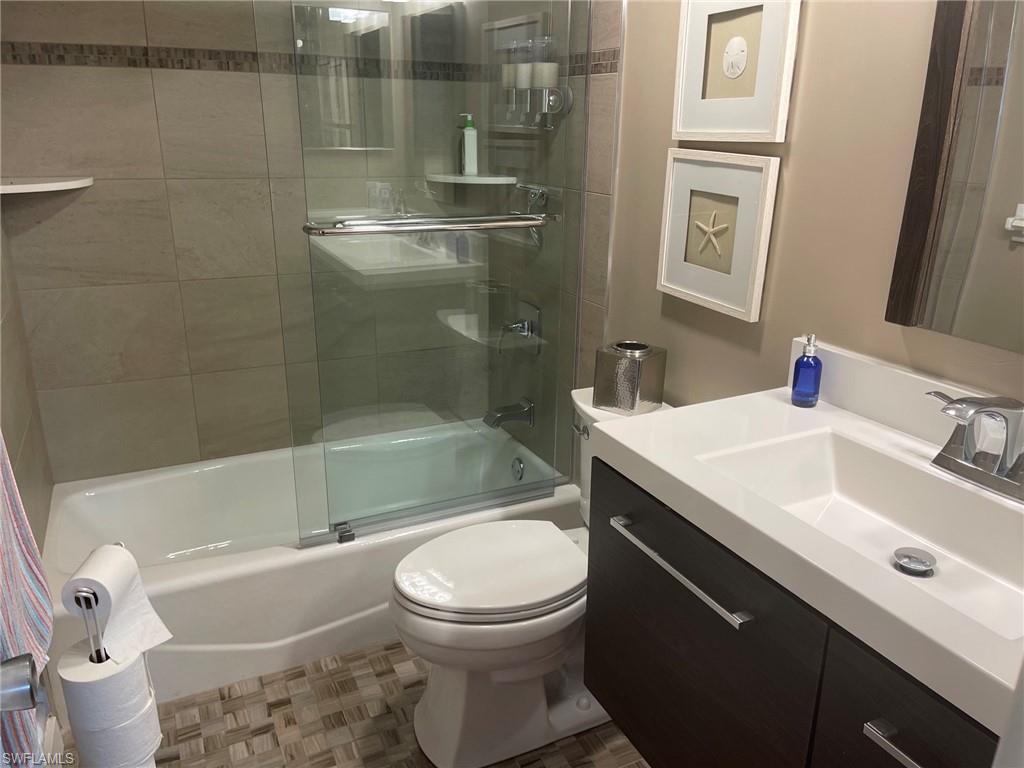 309 Goodlette-Frank Road, Unit 306A Naples, FL 34102 - Photo 15 of 19 a bathroom with a sink toilet and shower