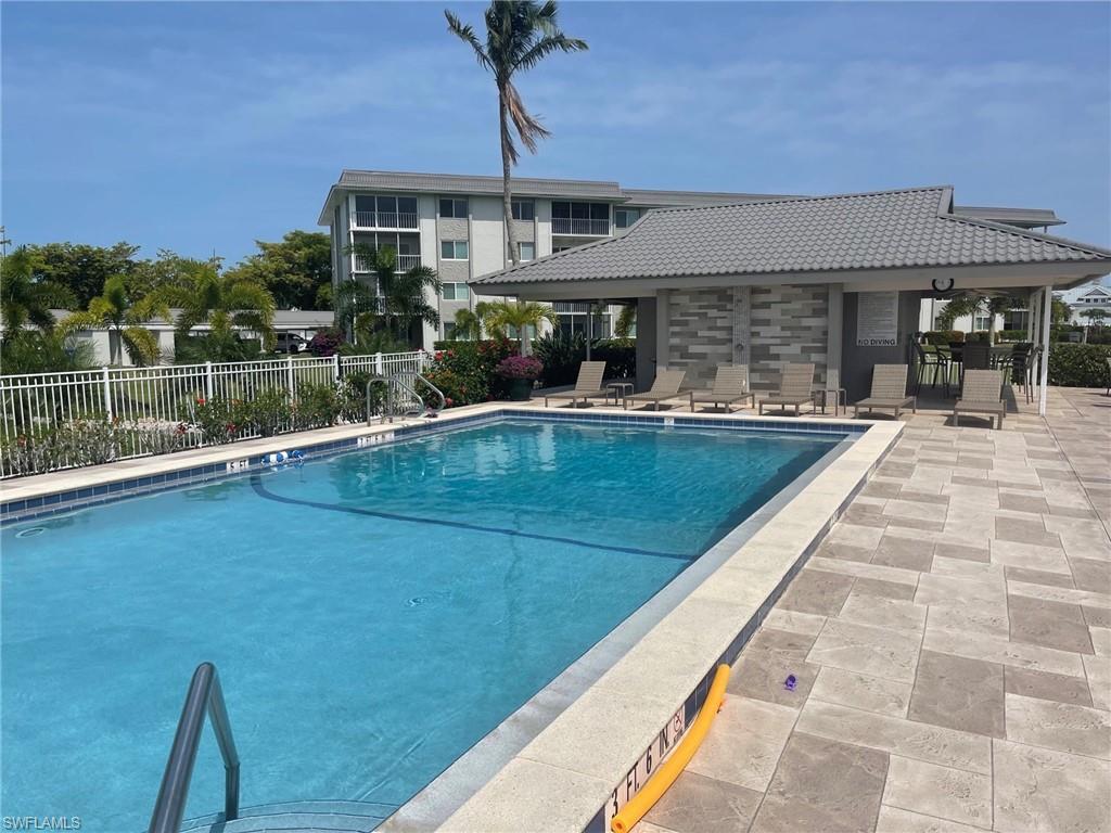 309 Goodlette-Frank Road, Unit 306A Naples, FL 34102 - Photo 19 of 19 a view of a house with pool