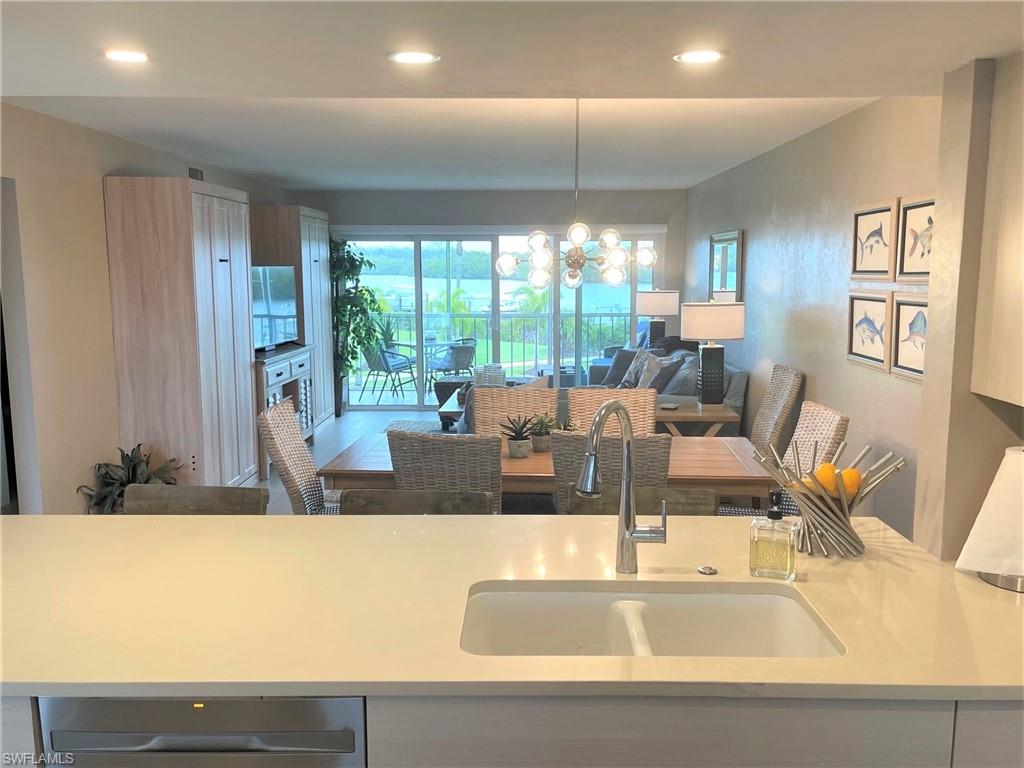 309 Goodlette-Frank Road, Unit 306A Naples, FL 34102 - Photo 4 of 19 a view of living room with furniture and a large window