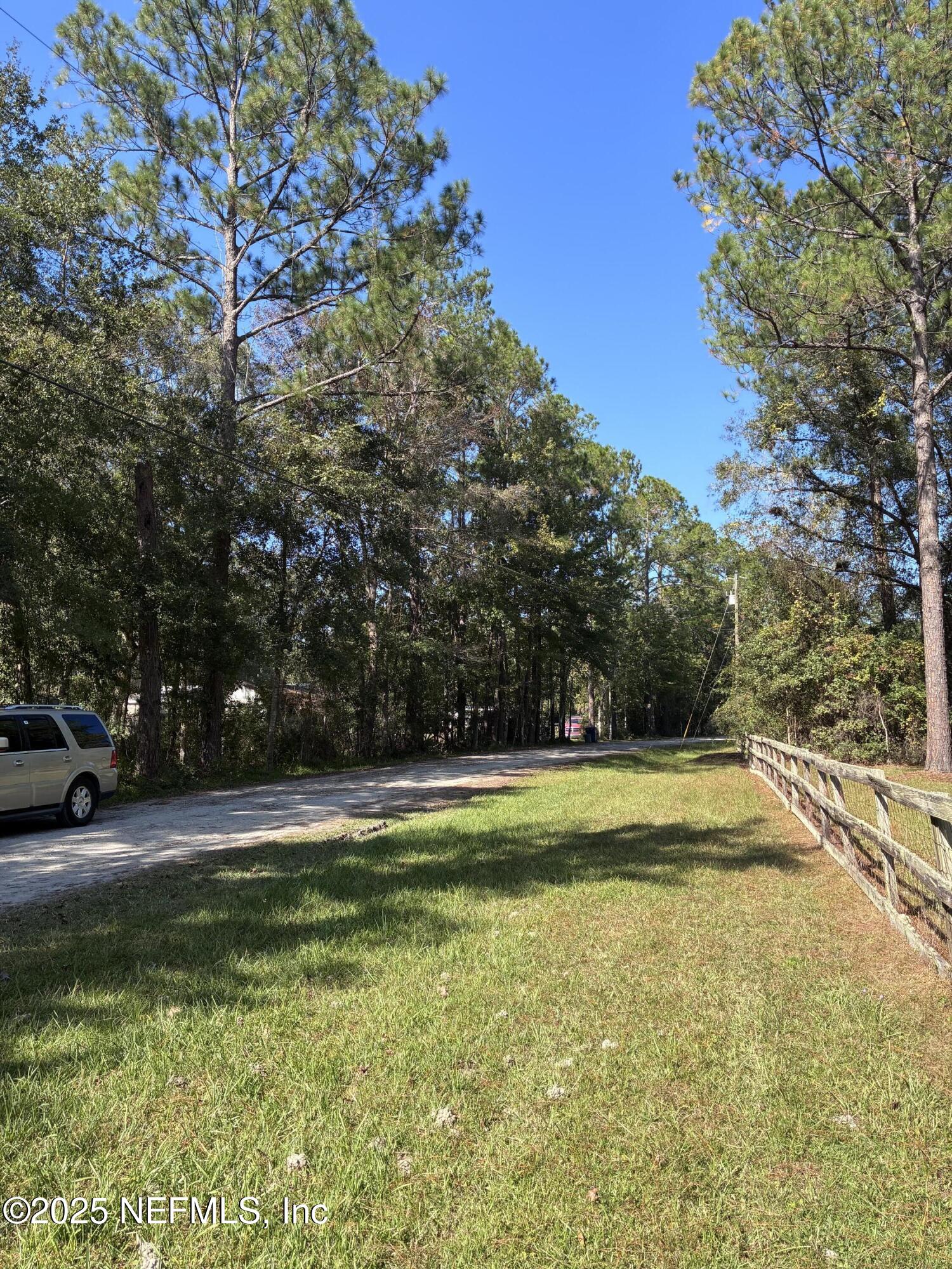 0 Korey's Lane Callahan, FL 32011 - Photo 12 of 12 a view of a yard with a house
