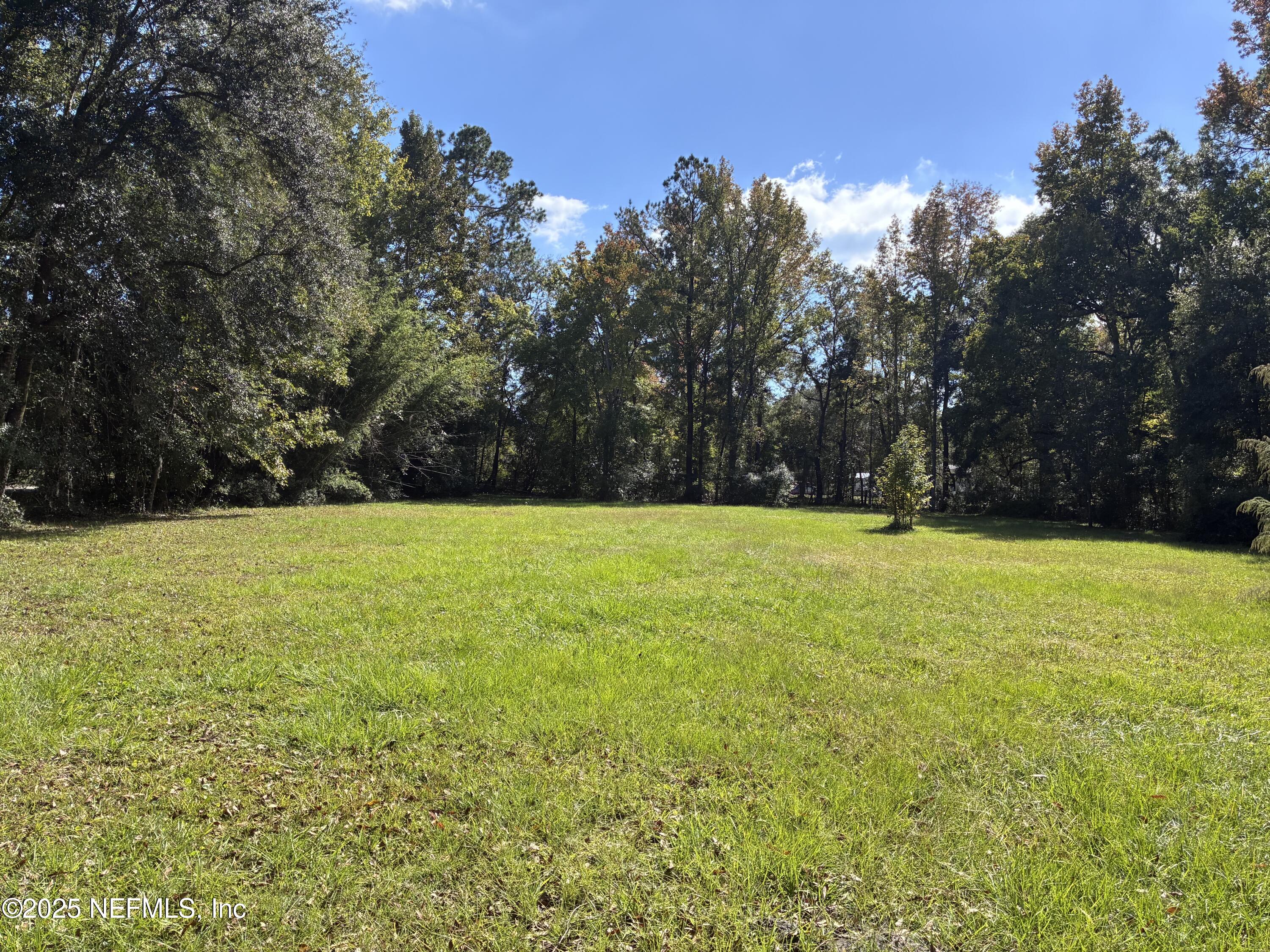 0 Korey's Lane Callahan, FL 32011 - Photo 8 of 12 a view of outdoor space with swimming pool and trees