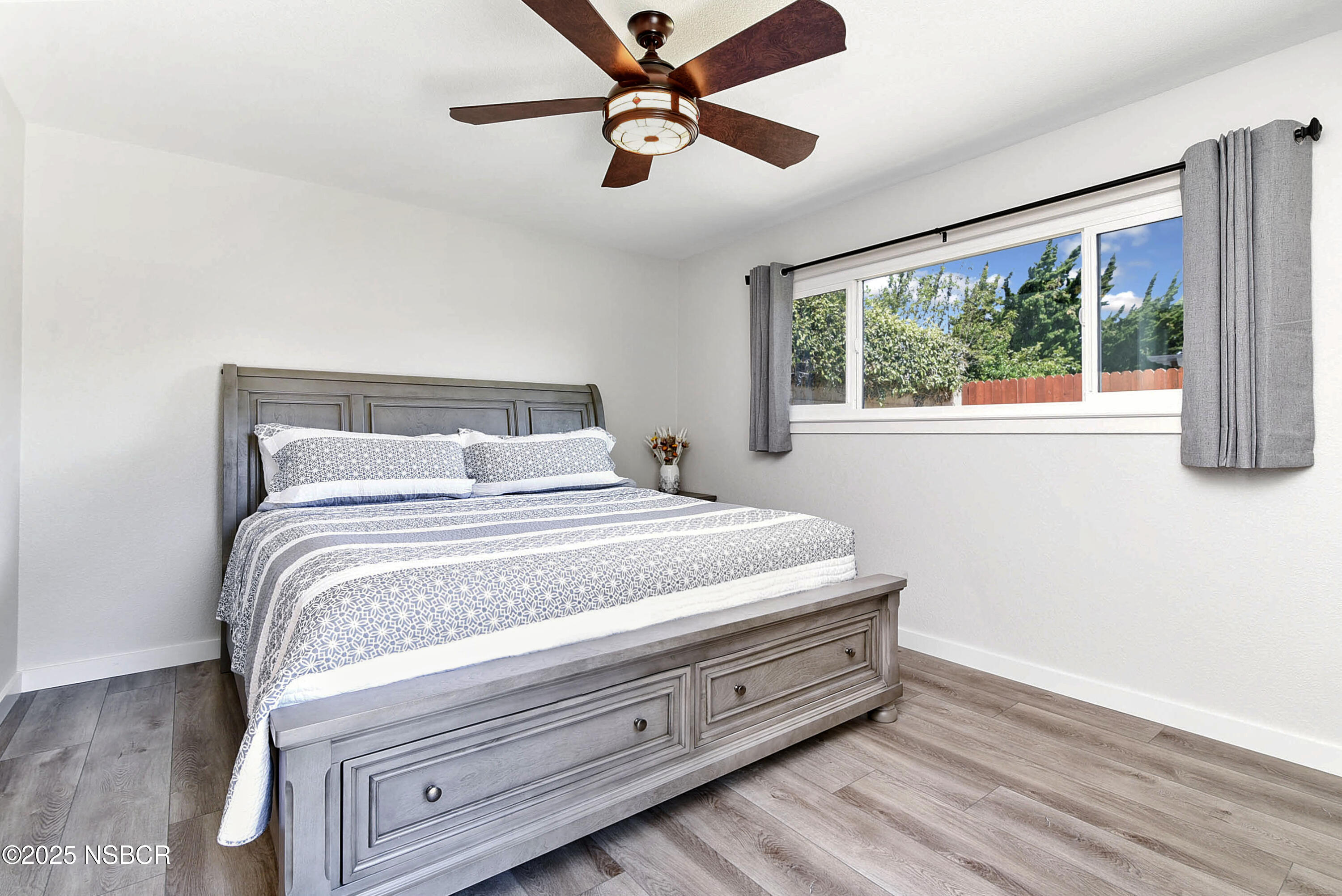 1133 Alden Avenue Lompoc, CA 93436 - Photo 17 of 27 a bedroom with a bed and a large window