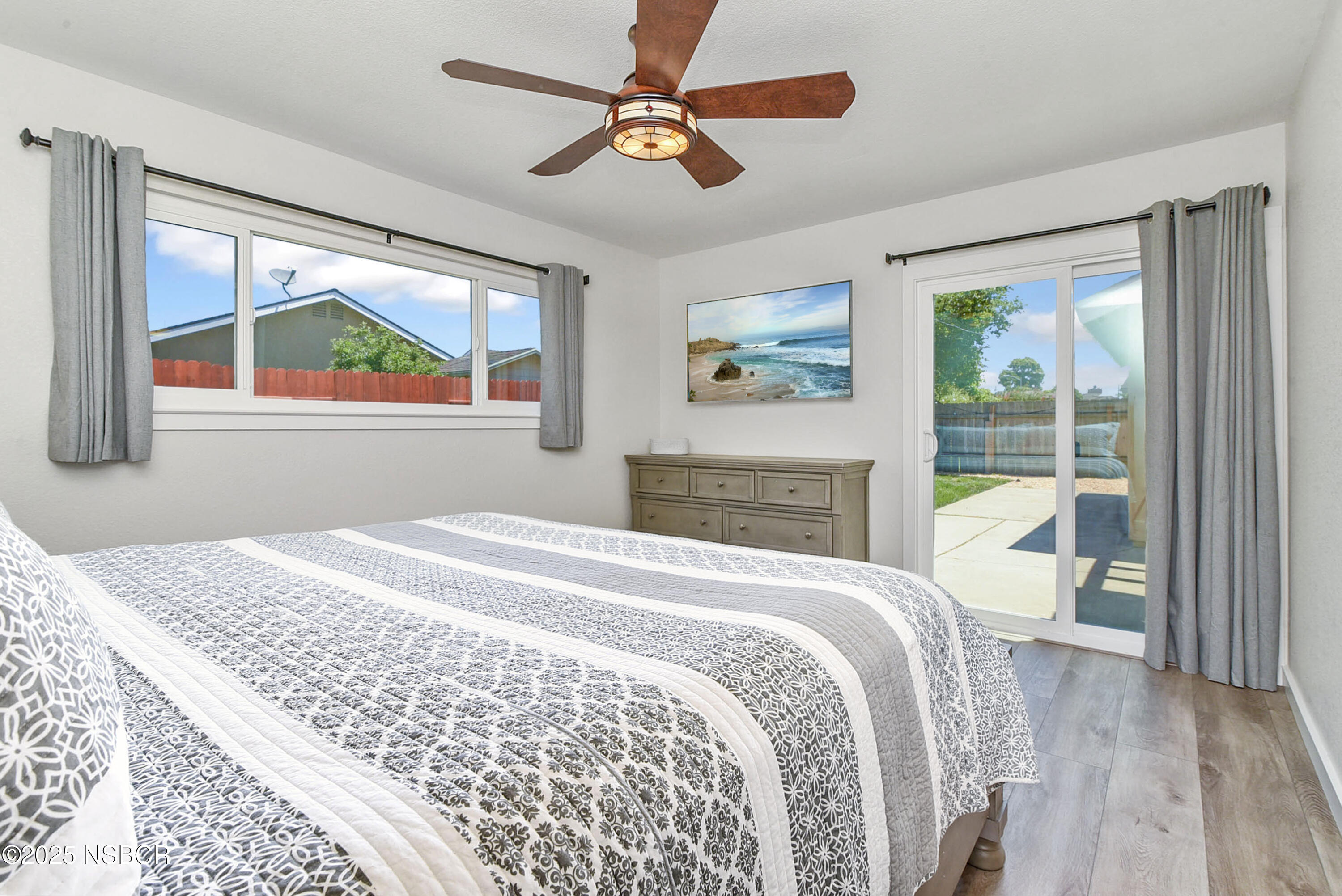 1133 Alden Avenue Lompoc, CA 93436 - Photo 18 of 27 a bedroom with a bed and a painting on the wall
