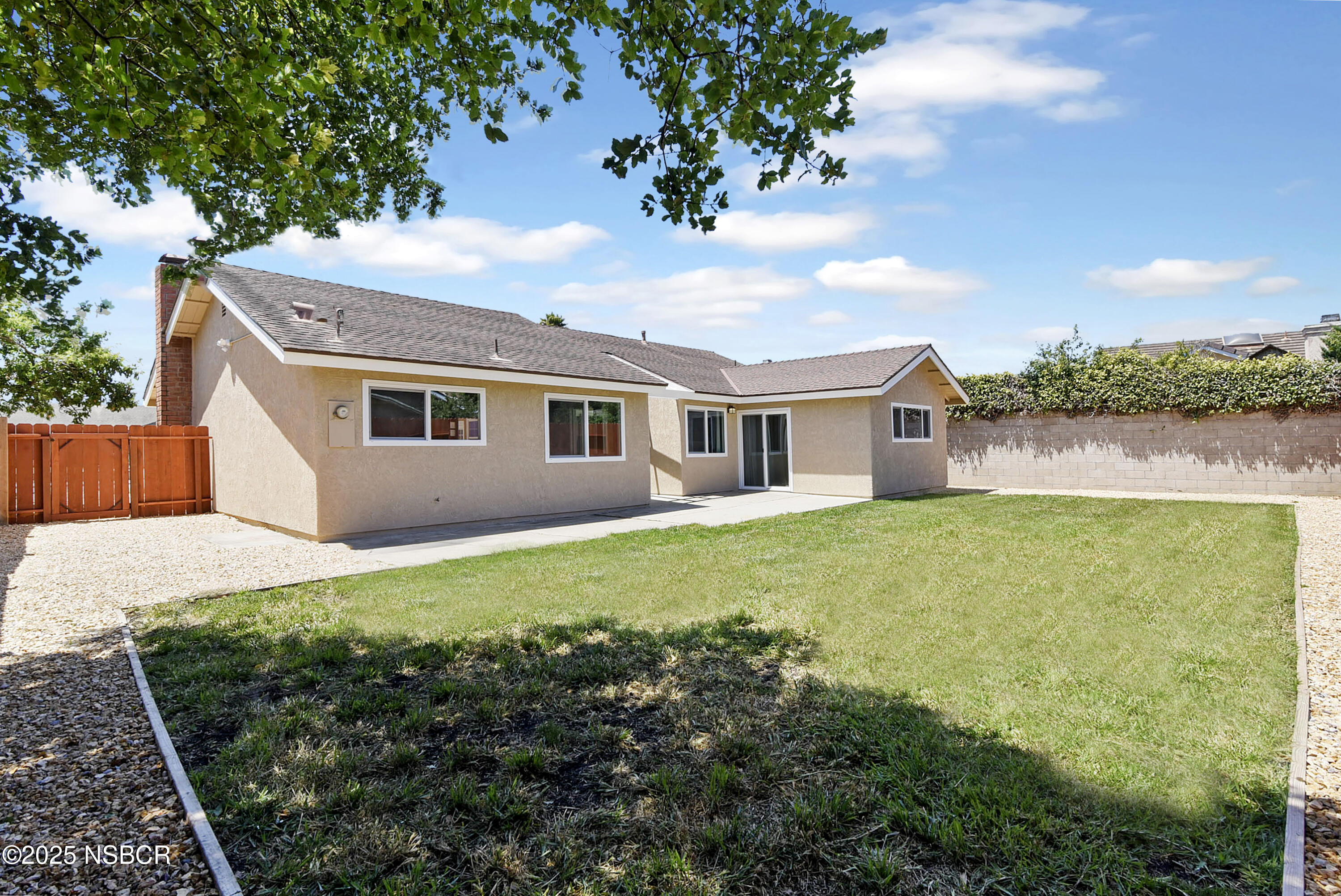1133 Alden Avenue Lompoc, CA 93436 - Photo 26 of 27 a backyard of a house with lots of green space