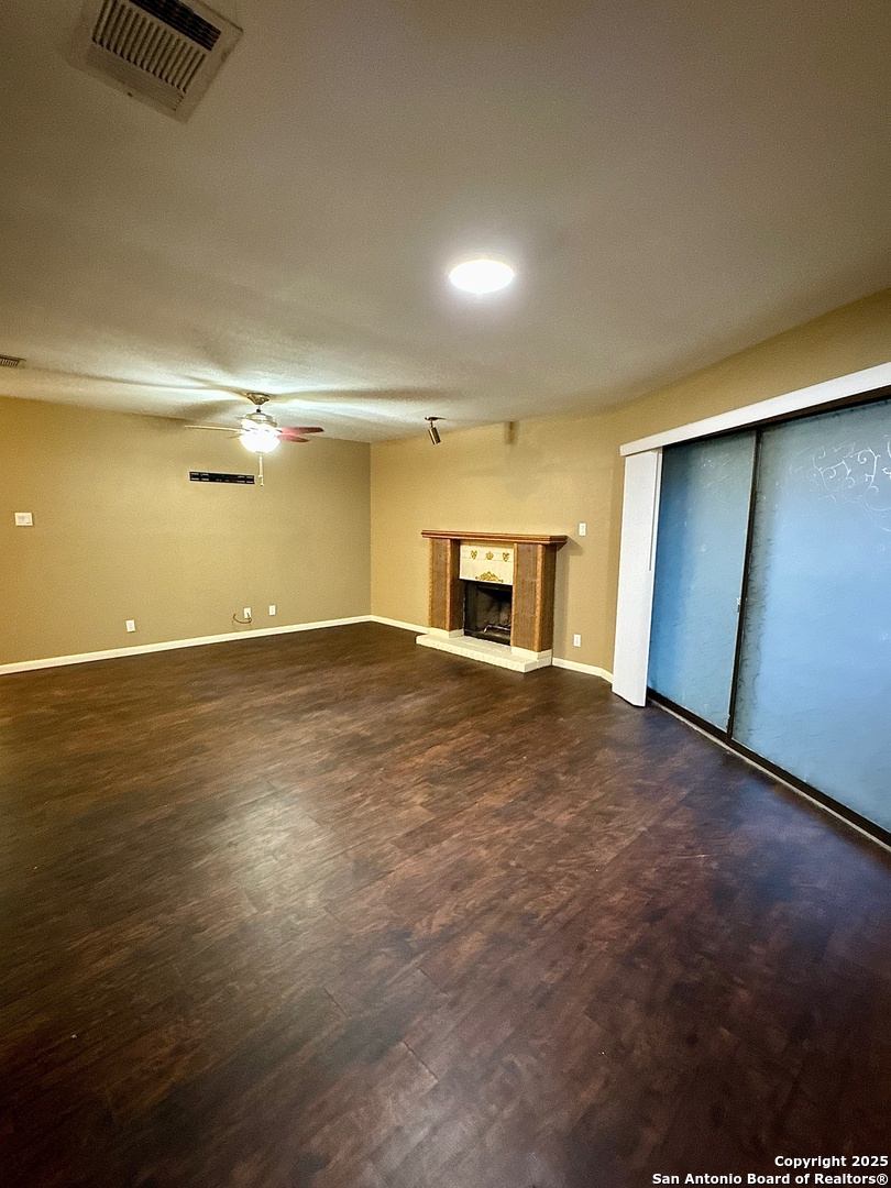 11520 Huebner Road, Unit 205 San Antonio, TX 78230 - Photo 2 of 8 a view of empty room with wooden floor