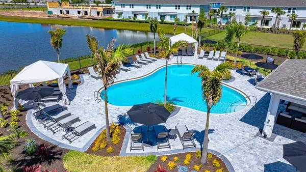 an aerial view of a house with a swimming pool