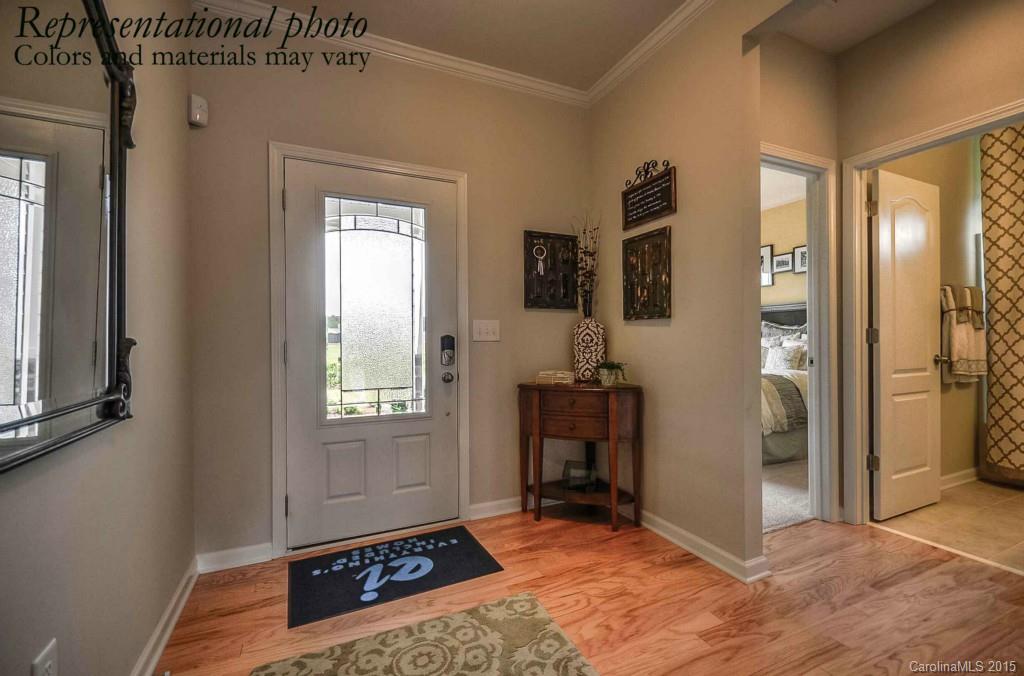 4270 Perth Road, Unit 312 Indian Land, SC 29707 - Photo 2 of 21 a view of an entryway with wooden floor and a livingroom