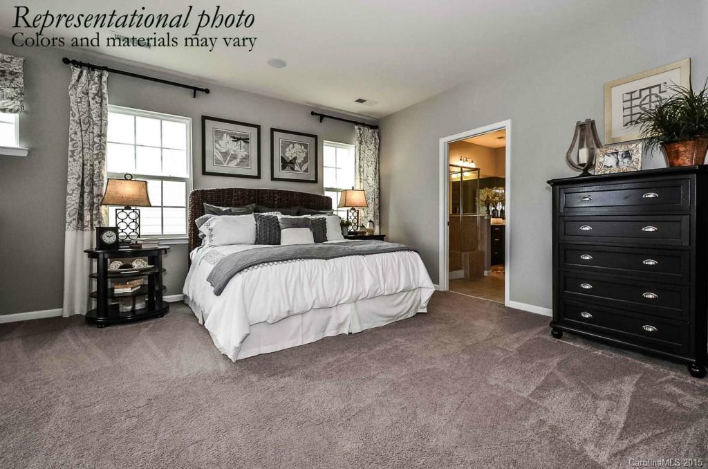 4270 Perth Road, Unit 312 Indian Land, SC 29707 - Photo 11 of 21 a bed room with a bed and a television