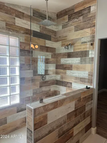 a bathroom with a shower and a sink