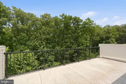 a view of a balcony and trees