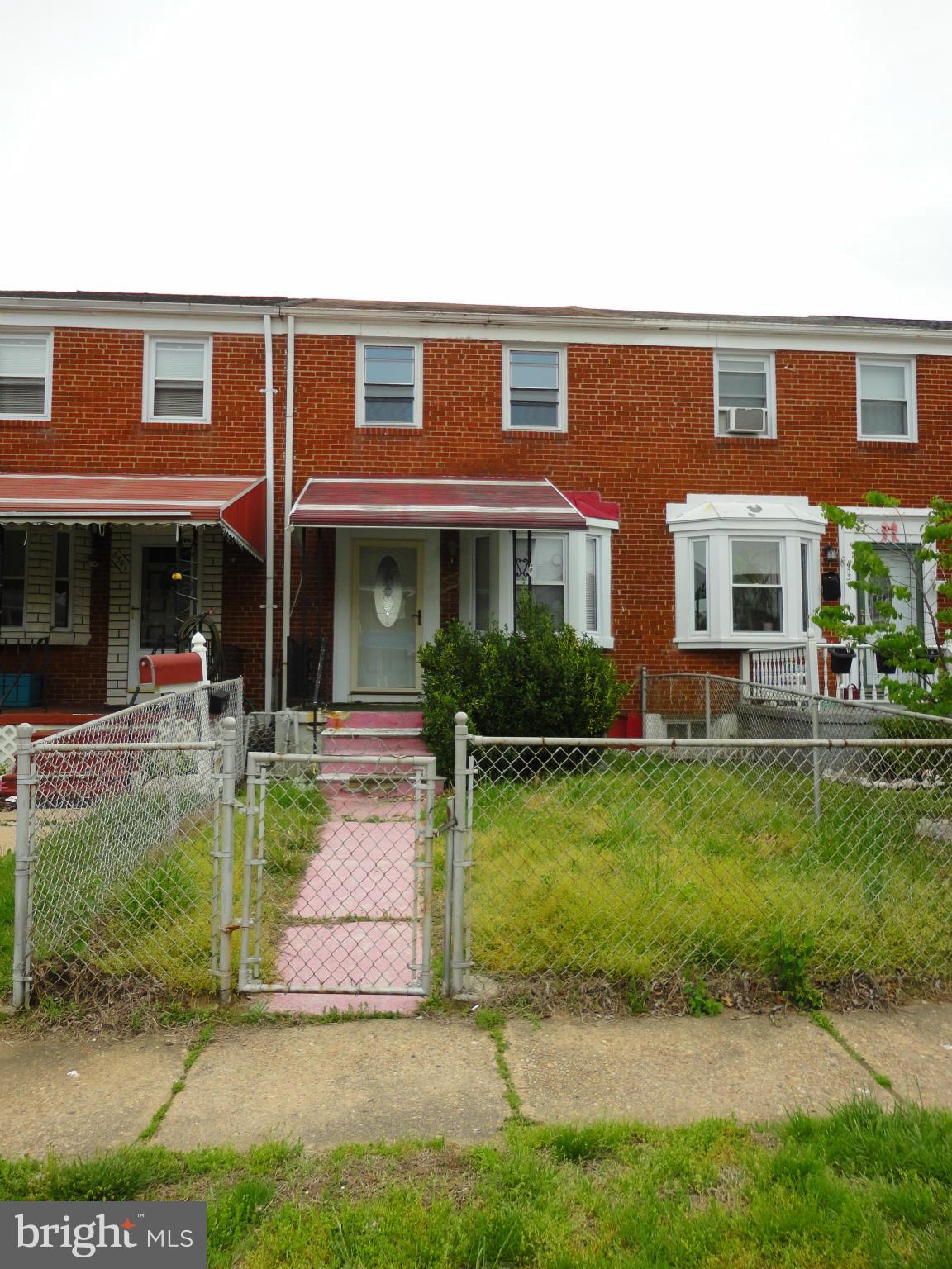 8539 Kavanagh Road Dundalk, MD 21222 - Photo 1 of 4 a front view of a house with a yard