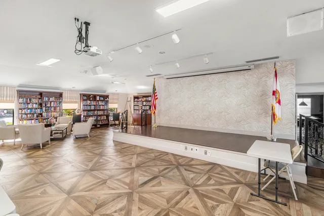a view of a living room and kitchen
