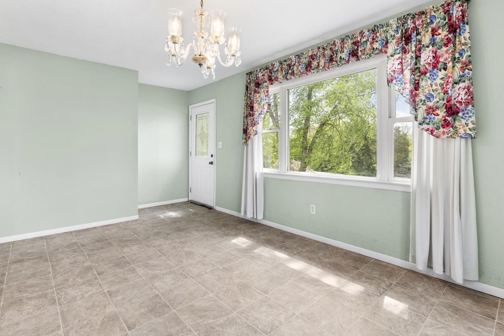 8530 North Kishwaukee Road Stillman Valley, IL 61084 - Photo 11 of 44 a view of livingroom with window
