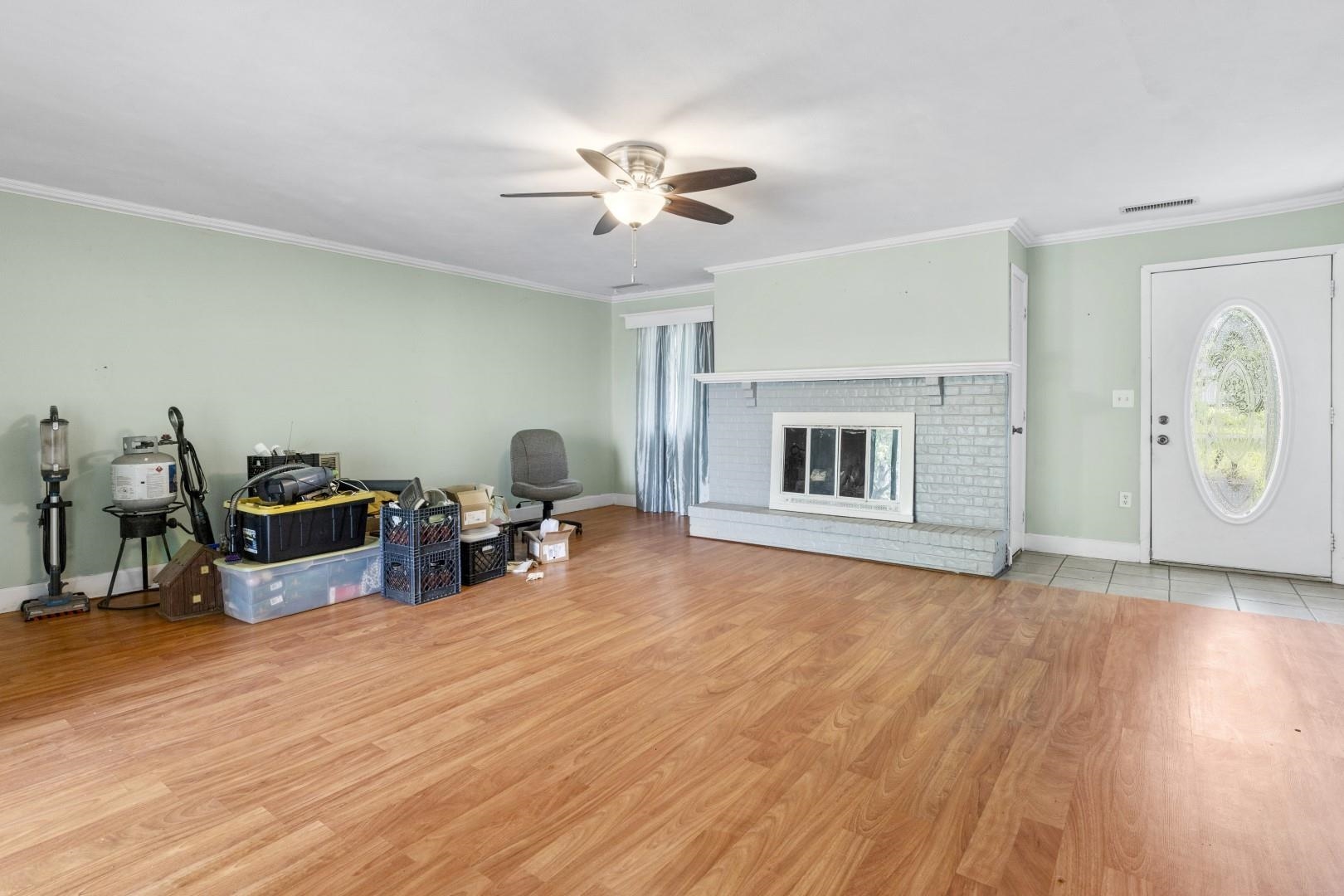 8530 North Kishwaukee Road Stillman Valley, IL 61084 - Photo 13 of 44 a living room with furniture and a fireplace