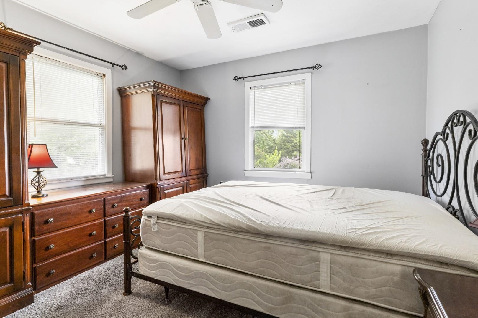 8530 North Kishwaukee Road Stillman Valley, IL 61084 - Photo 15 of 44 a bedroom with a bed and a window dresser
