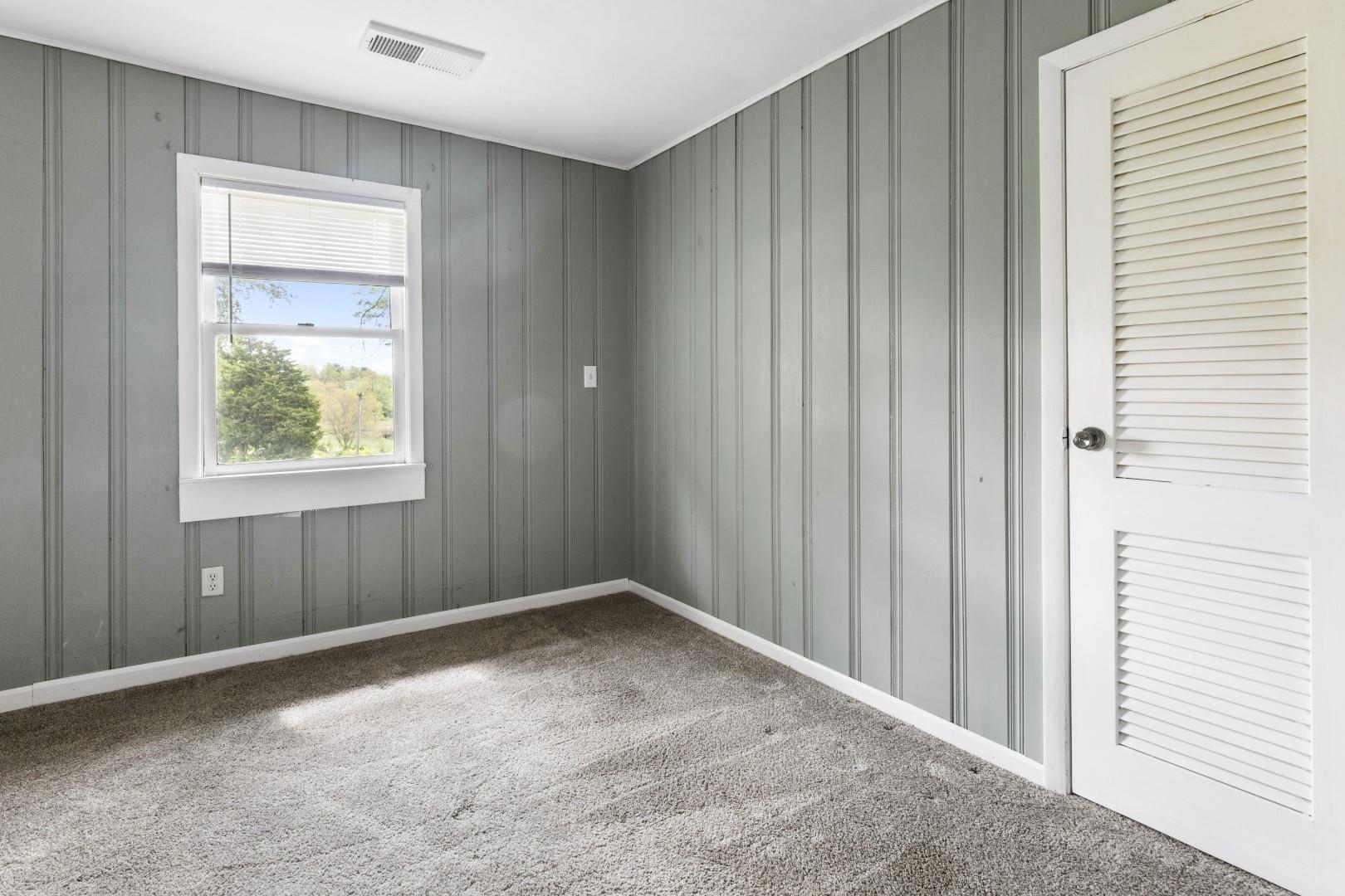 8530 North Kishwaukee Road Stillman Valley, IL 61084 - Photo 18 of 44 a view of an empty room with a window