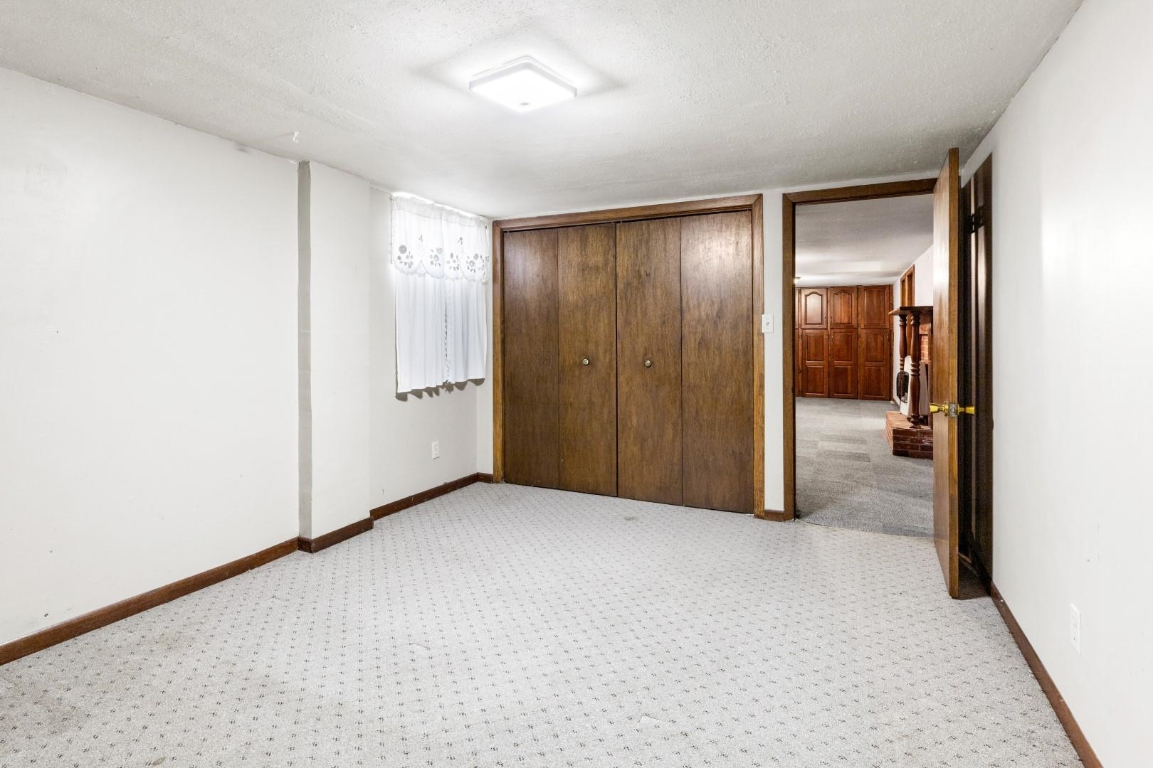 8530 North Kishwaukee Road Stillman Valley, IL 61084 - Photo 19 of 44 an empty room with closet and mirror