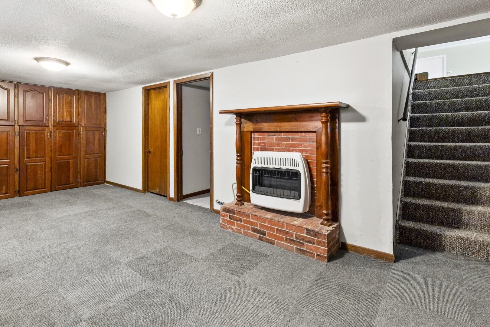 8530 North Kishwaukee Road Stillman Valley, IL 61084 - Photo 21 of 44 a view of an empty room with wooden floor and a window