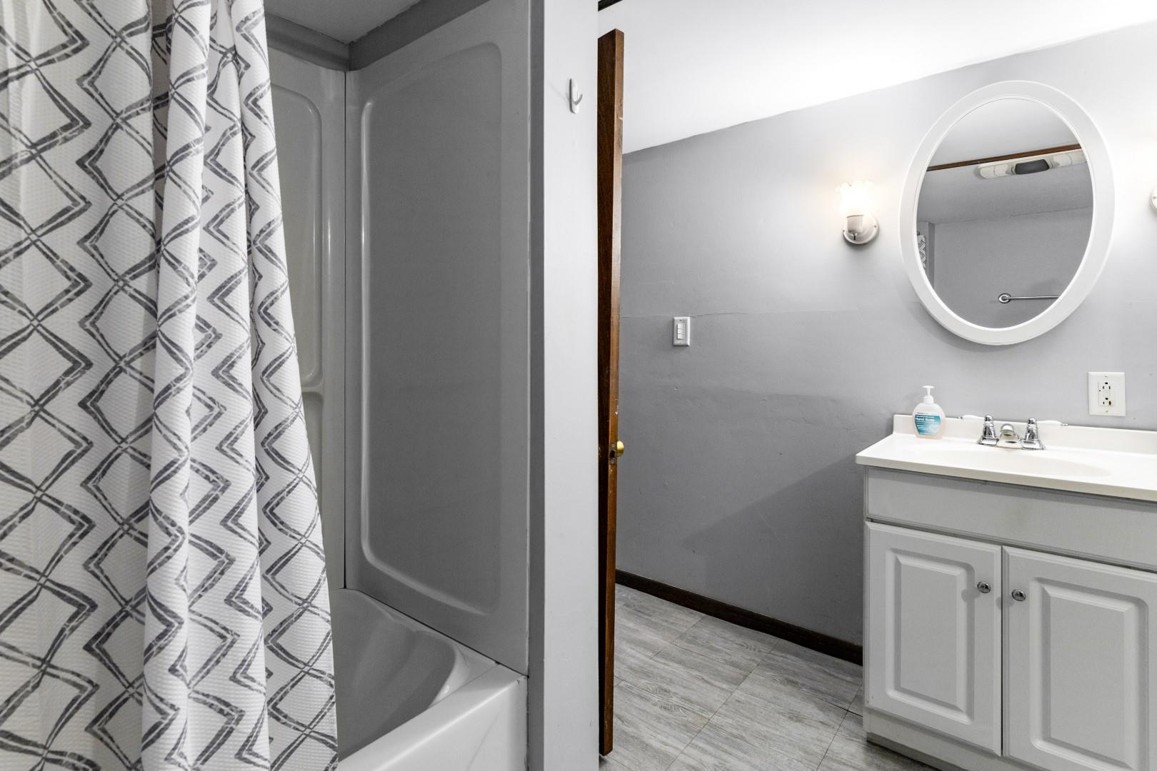 8530 North Kishwaukee Road Stillman Valley, IL 61084 - Photo 24 of 44 a bathroom with a sink a toilet and a mirror