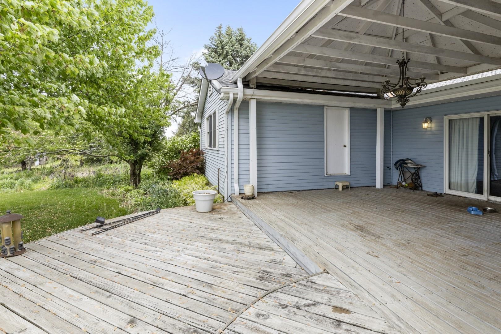 8530 North Kishwaukee Road Stillman Valley, IL 61084 - Photo 30 of 44 a view of a backyard with a small cabin