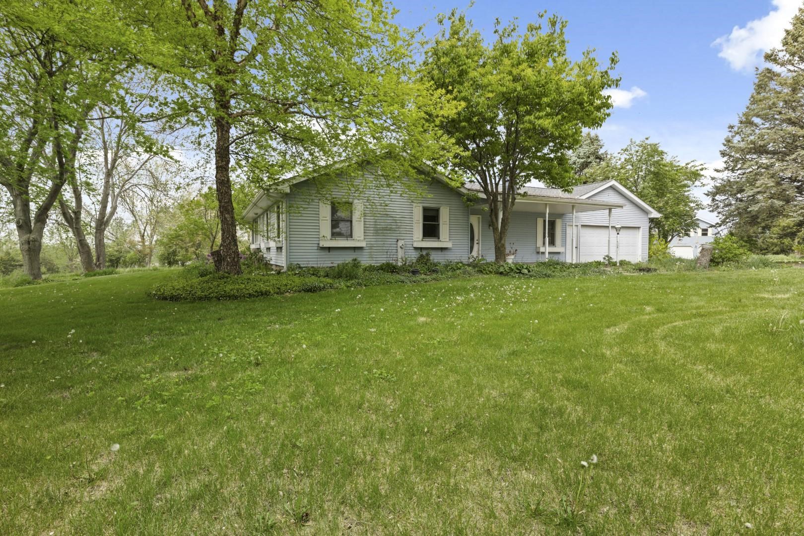 8530 North Kishwaukee Road Stillman Valley, IL 61084 - Photo 3 of 44 front view of a house with a yard