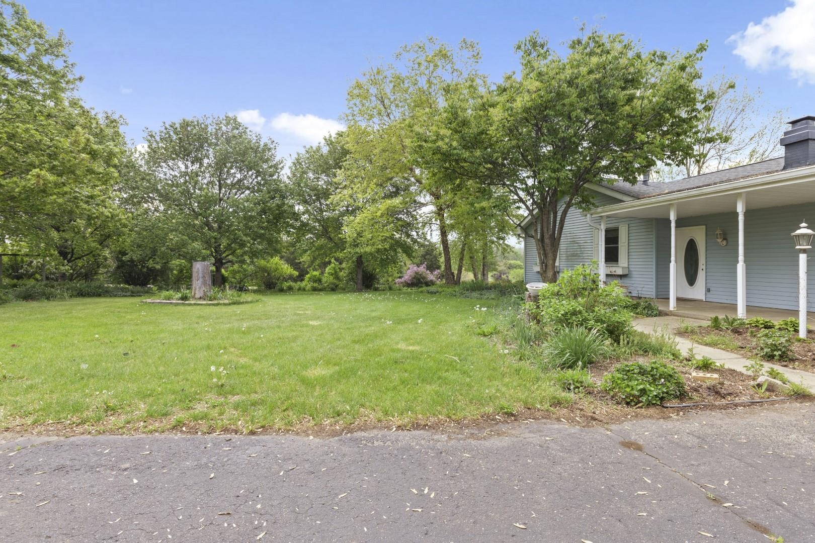 8530 North Kishwaukee Road Stillman Valley, IL 61084 - Photo 34 of 44 a front view of house with yard