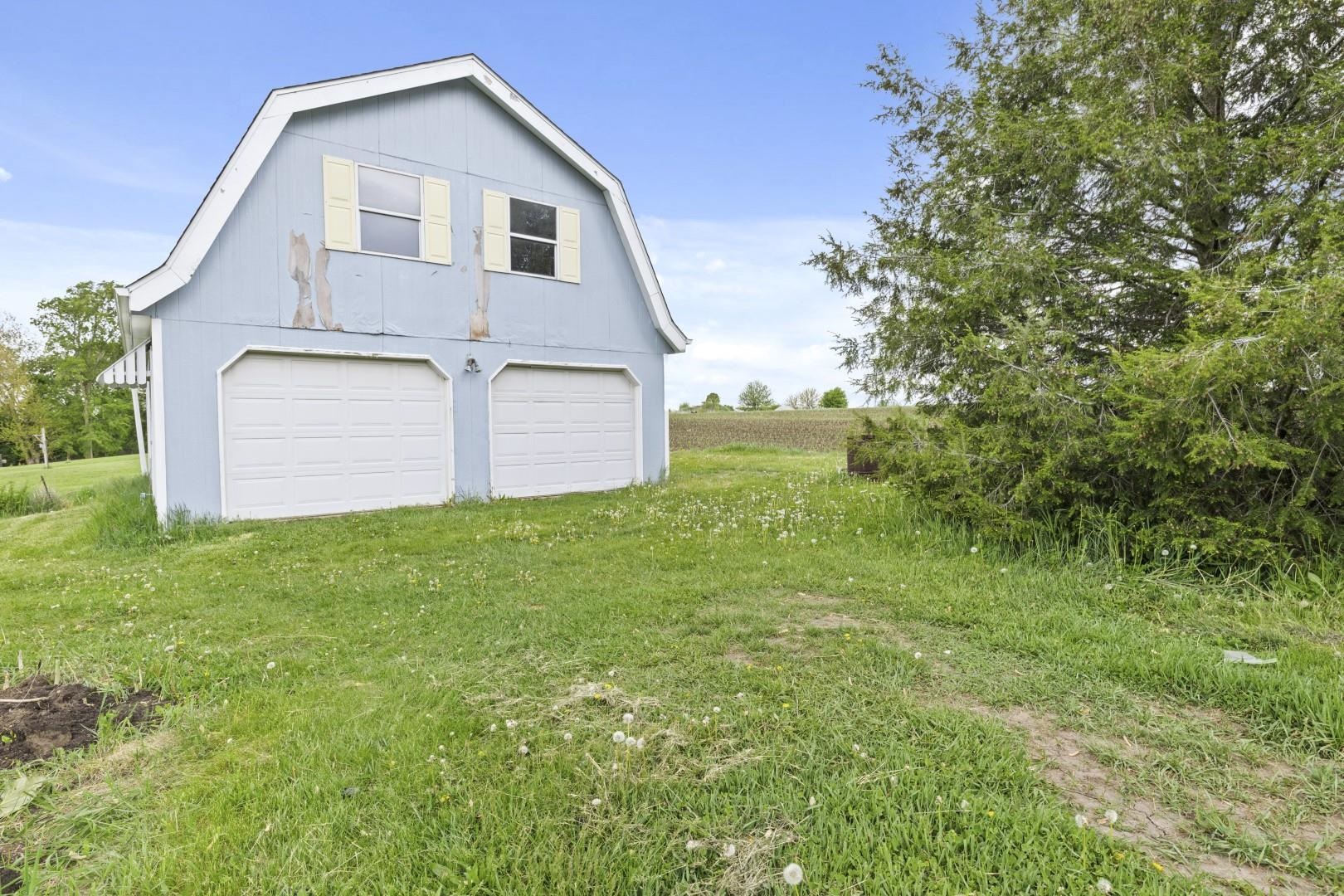 8530 North Kishwaukee Road Stillman Valley, IL 61084 - Photo 39 of 44 a front view of house with garden