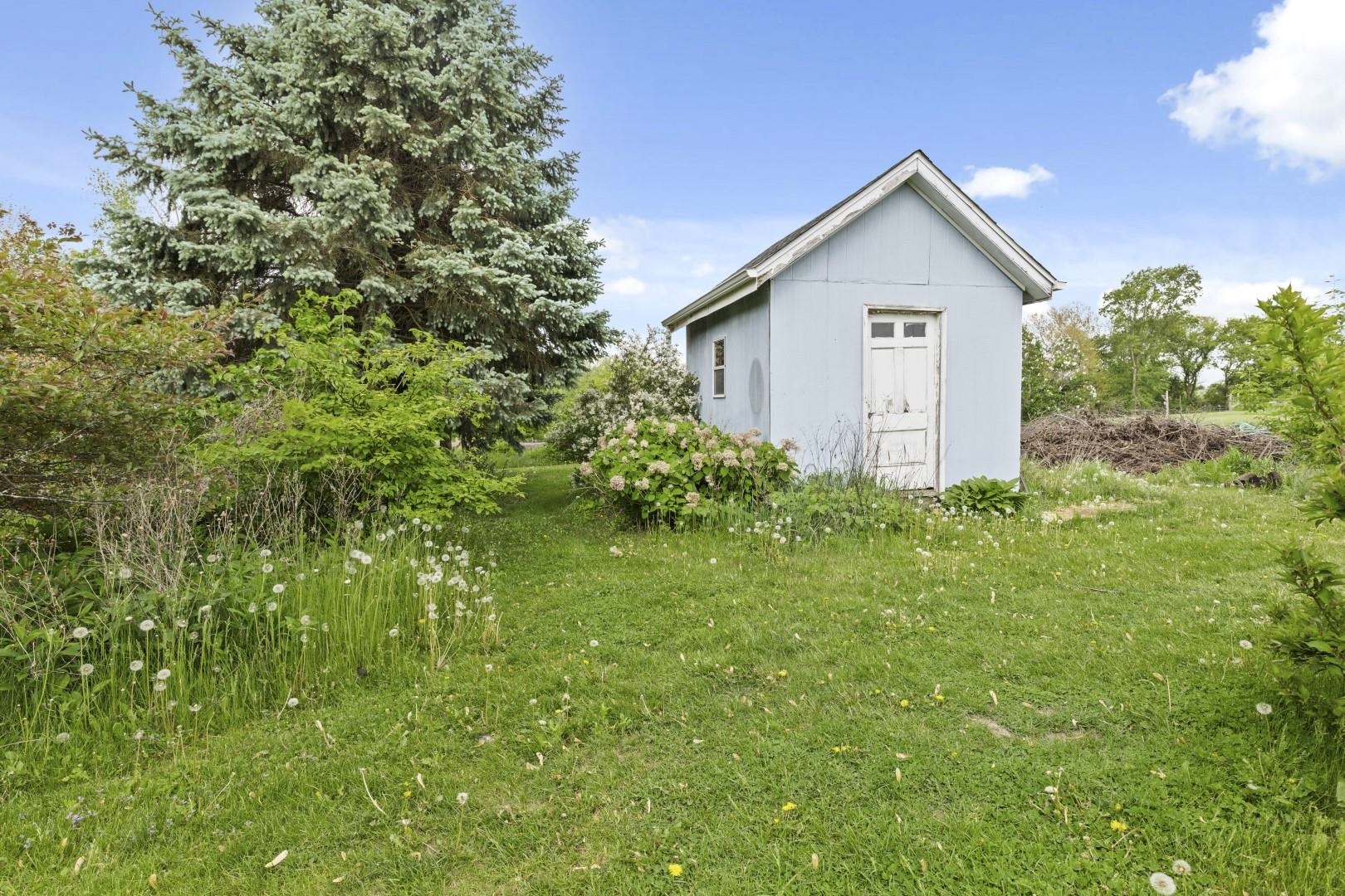 8530 North Kishwaukee Road Stillman Valley, IL 61084 - Photo 40 of 44 a view of a house with a yard